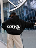 سویشرت زنانه کلاهدار زیپدار با جیب کانگورویی و نوشته Not You در پشت لباس.